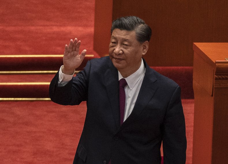Chinese President Xi Jinping waves after speaking
