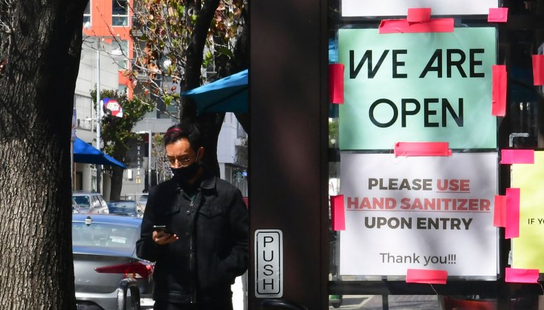 A "We Are Open" sign is seen 