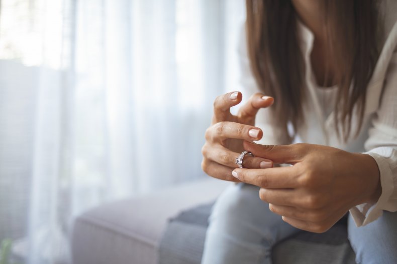 woman taking ring off