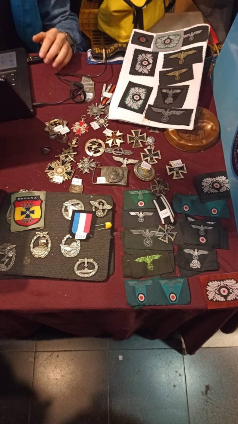 Picture shows some of the items with Nazi symbols confiscated by police, undated. A man was arrested for selling them at a fair in Buenos Aires, Argentina. (Policia de la Ciudad/Zenger)