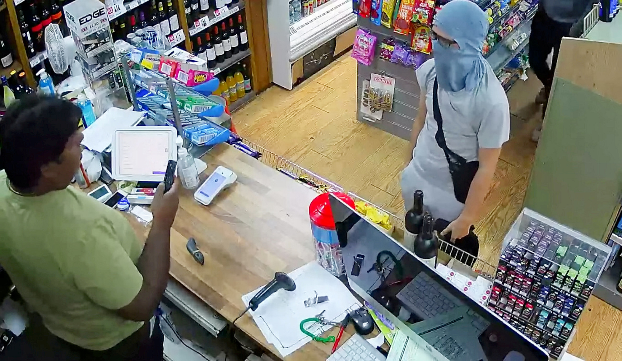 Watch: Store Owner, a Former Cop, Thwarts Robbery With Bottle of Vodka