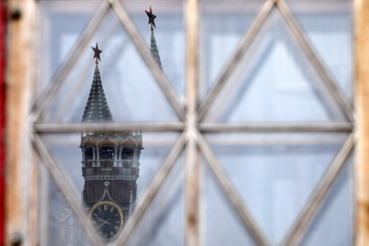 Kremlin's Spasskaya tower is reflected 