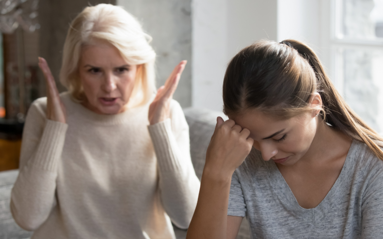 An older mom scolding her daughter.