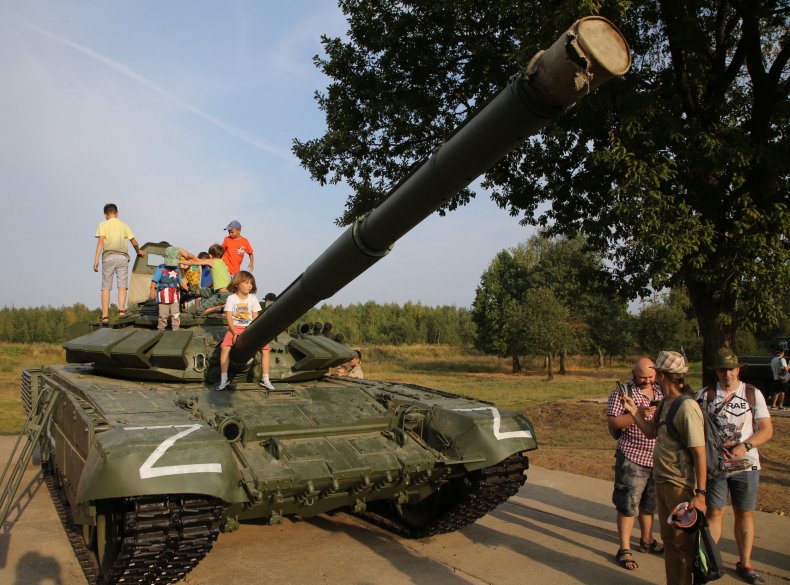 Children play on a T-72 tank