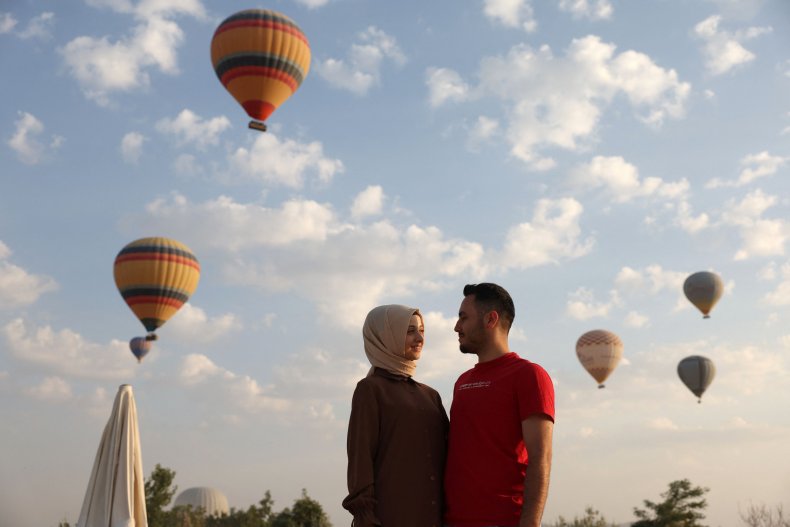 Couple embracing in Turkey's Cappadocia region.