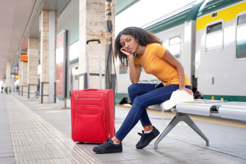 woman waits for train