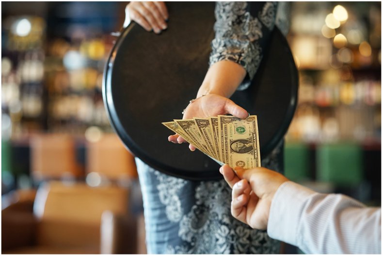 Stock image of woman tipping