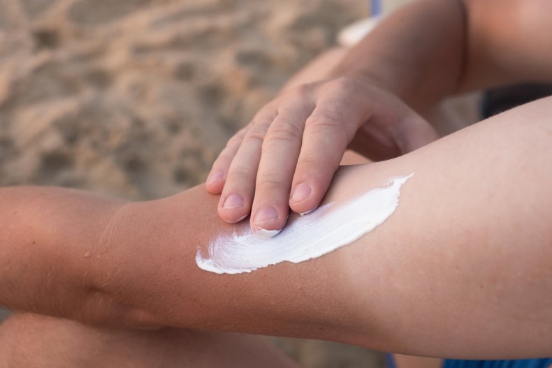 Man applying sunscreen