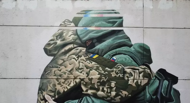 Artist defends ‘offensive’ mural depicting Ukrainian and Russian troops embracing