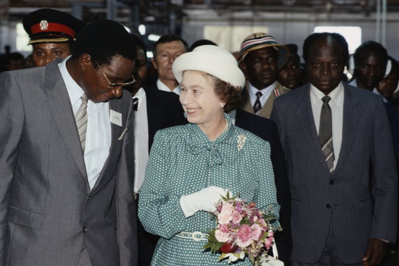 Queen Elizabeth II holding flowers in Kenya