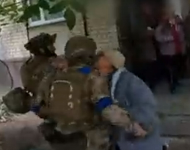 Screen grab of woman greeting soldier