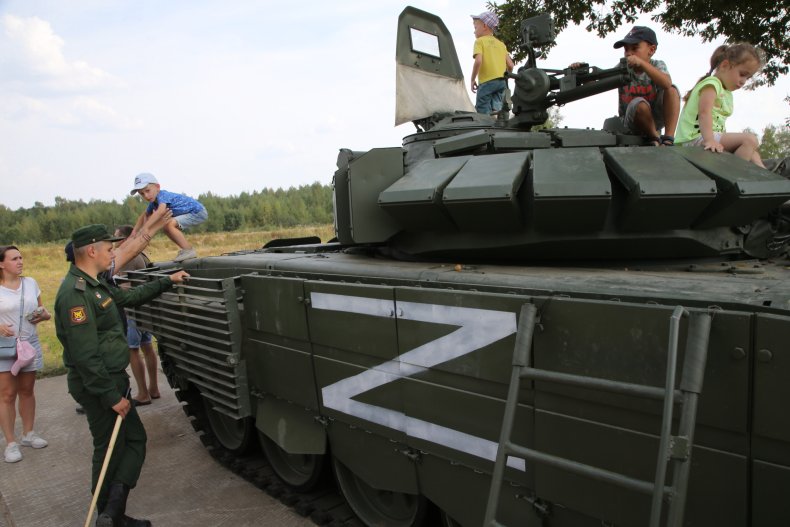 Children play on a T-72 tank