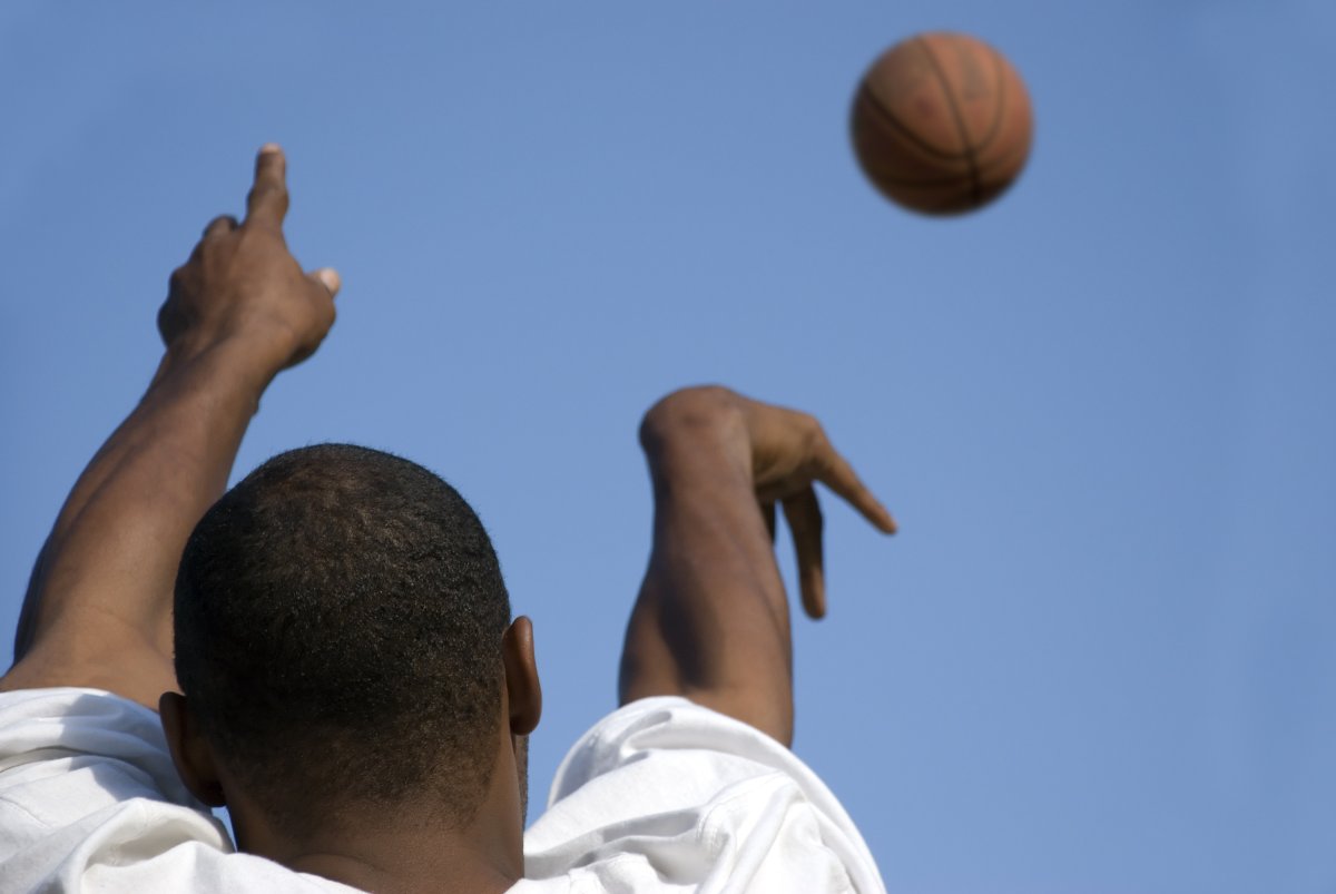 File photo of teen and basketball. 