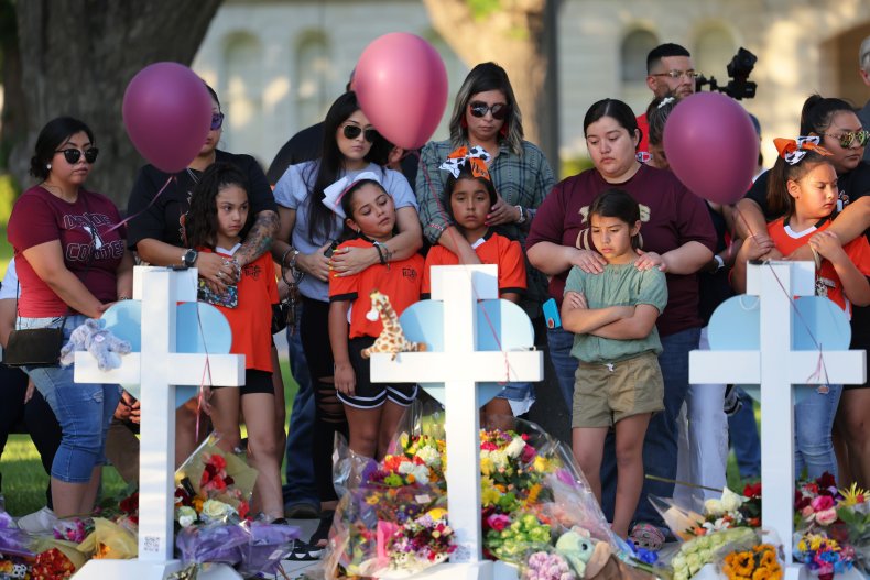People visit memorials for victims