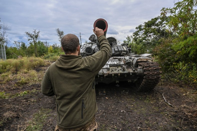 Ukrainian soldier with captured tank