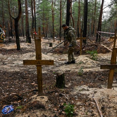 Solider at Mass Grave Site Solider at Mass Grave Site
