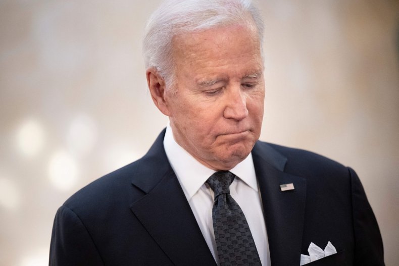 U.S. President Joe Biden looks on as