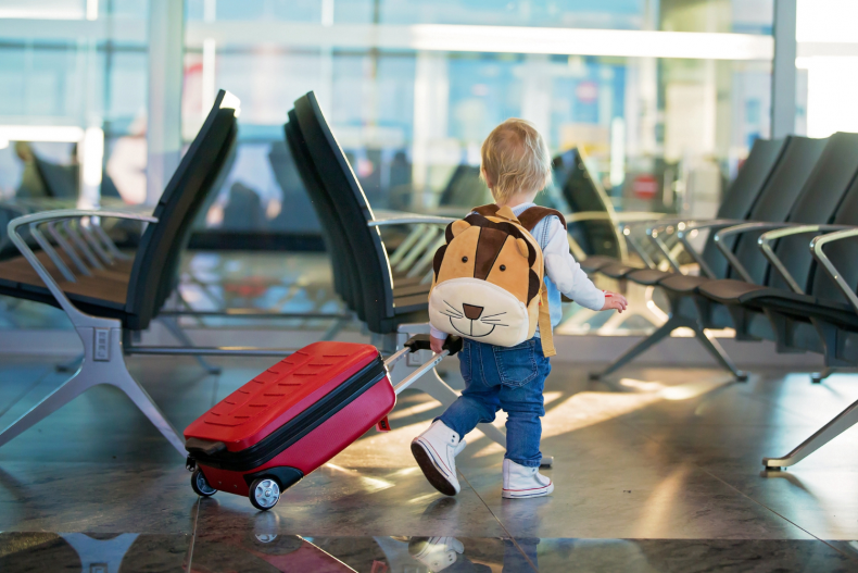 Child walking through airport