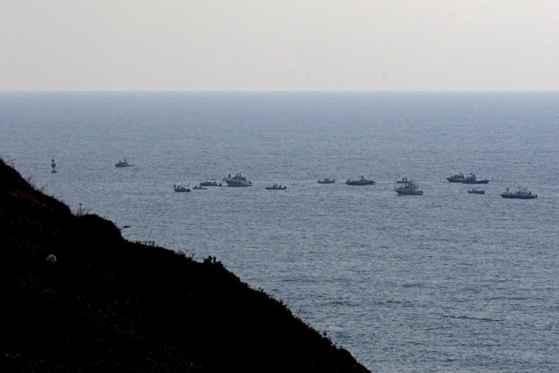 Lebanese protesters sail in boats with slogans
