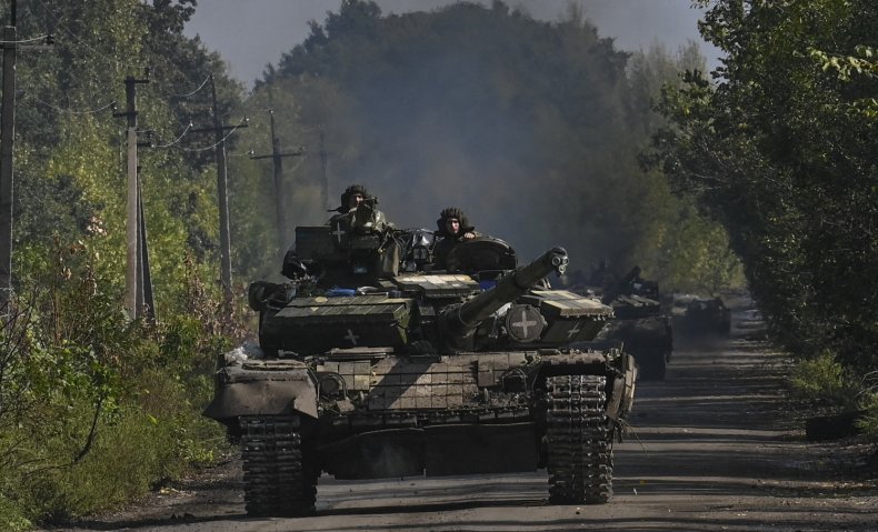 Ukrainian soldiers ride a tank