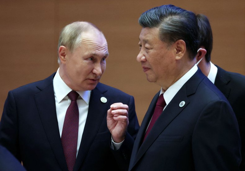 Russian President Vladimir Putin speaks to Chinese