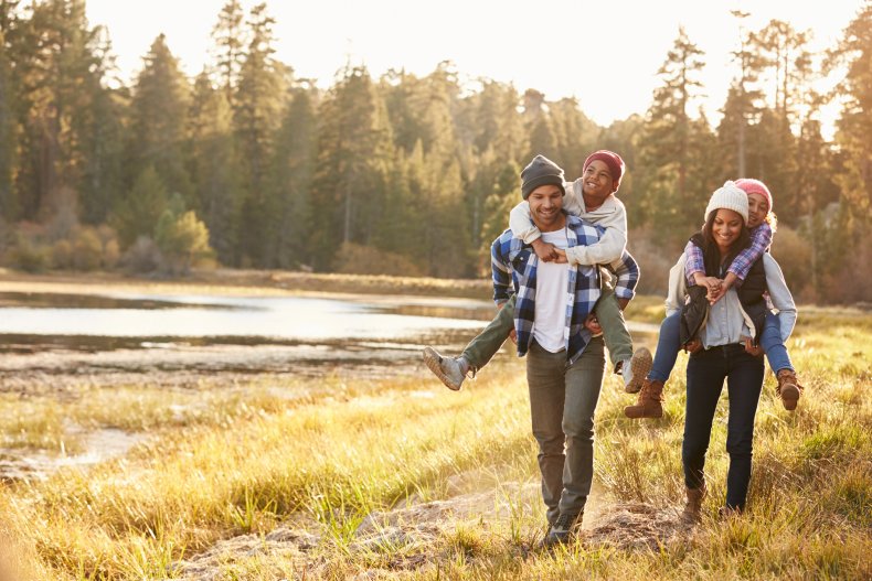 family walking by lake