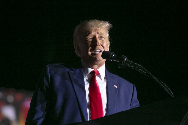 Trump arrives in Michigan under pressure