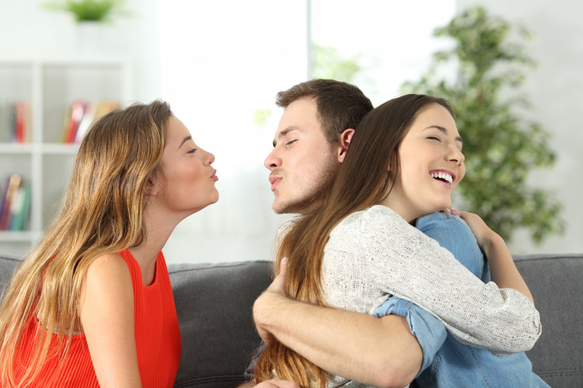 man interacting with two women