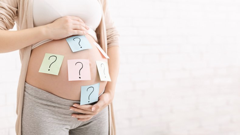 Pregnant bump with question marks on