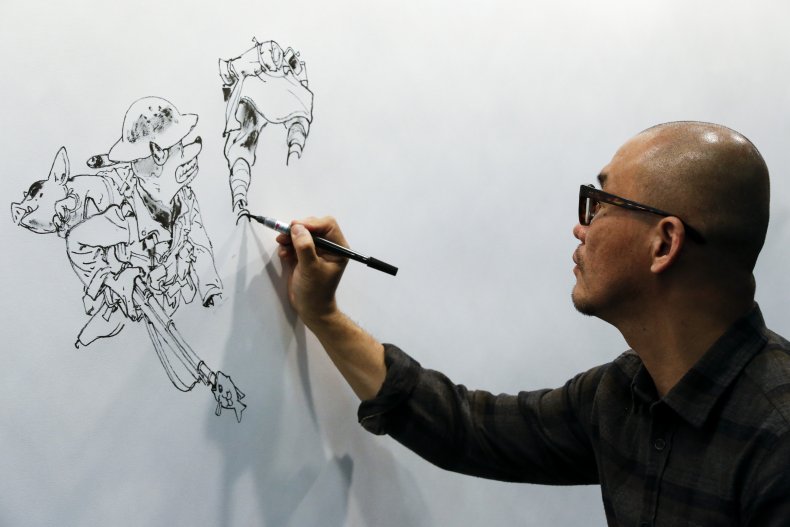 Artist Kim Jung Gi creates an illustration