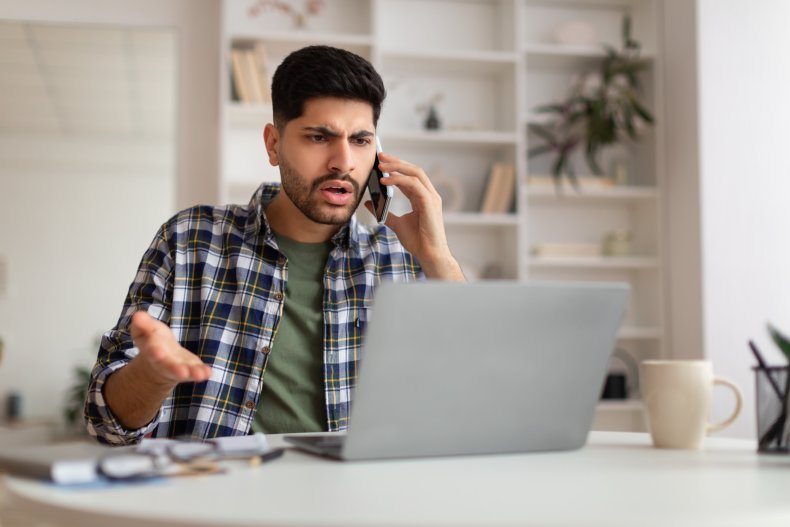 Man at computer frustrated with customer service
