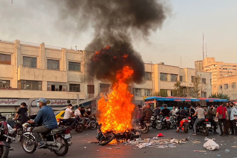 Burning, motorcycle, women's, rights, protests, Tehran, Iran