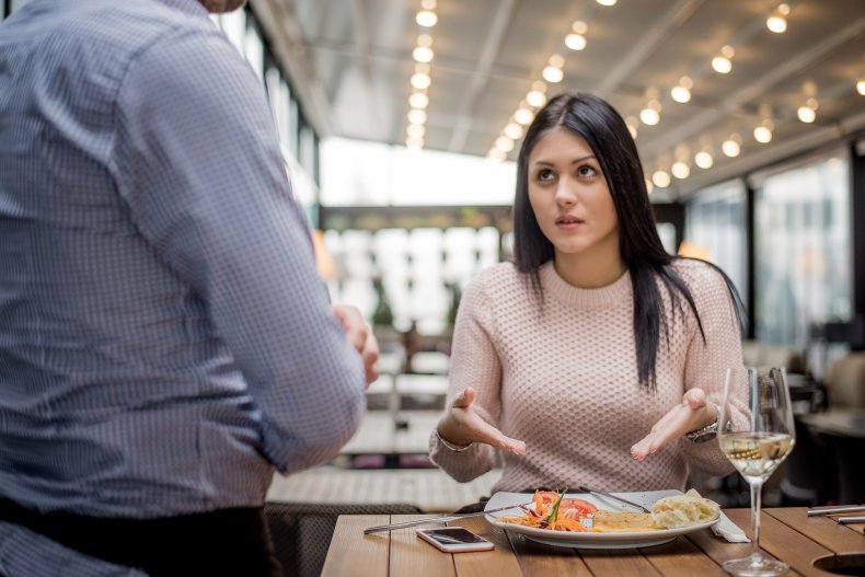 Woman displeased by meal at restaurant