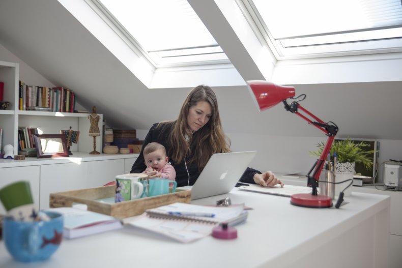 Woman works from home with baby