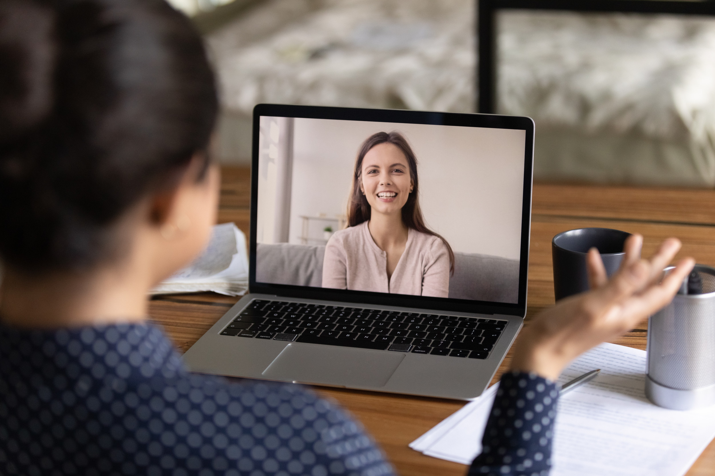 Happy young millennial colleagues having virtual talk