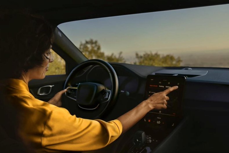 woman in yellow shirt in connected car