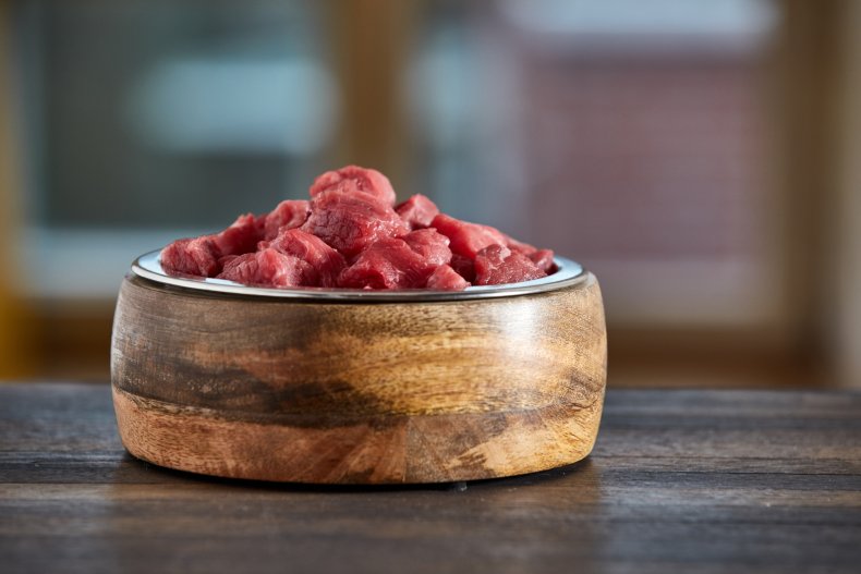 Raw beef in dog bowl. 