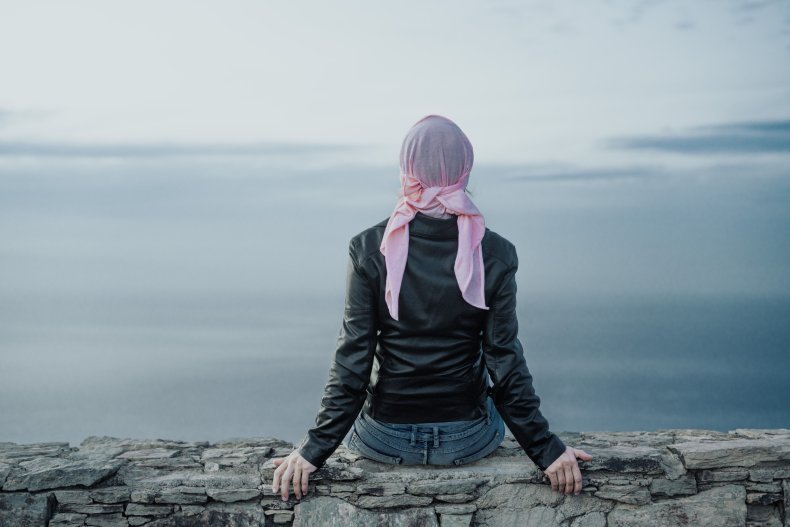 woman with pink scarf on head