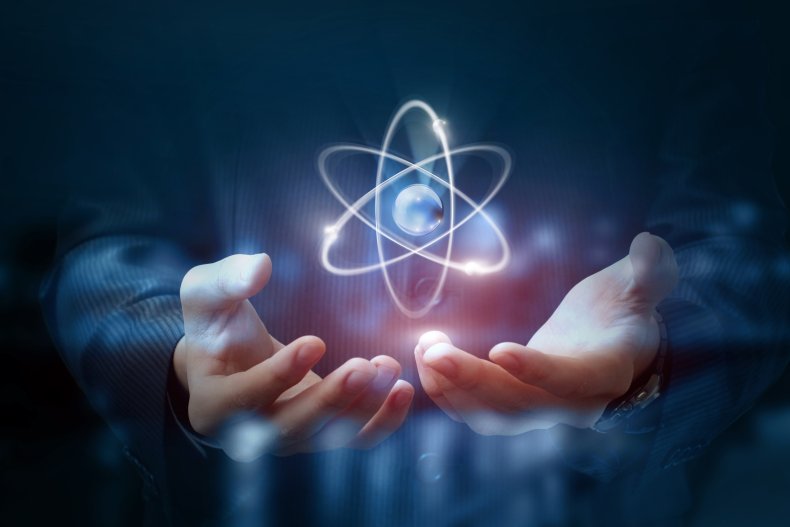 Person holding atom