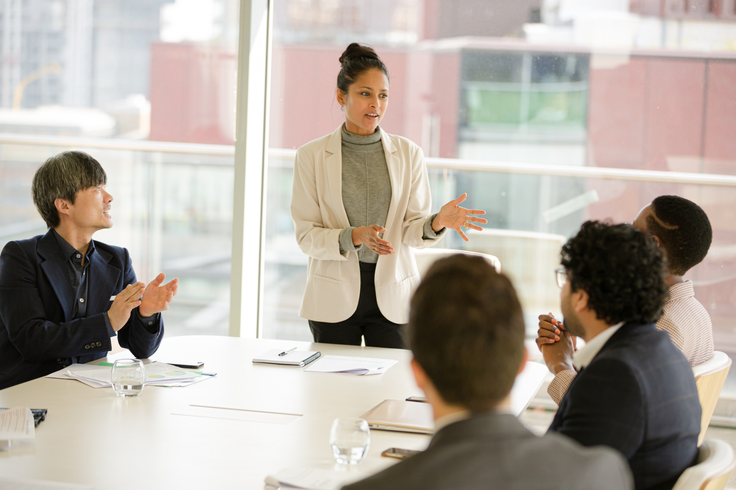 Businesswoman leading conference room meeting