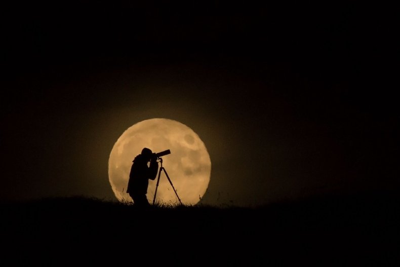 A man photographing the sky