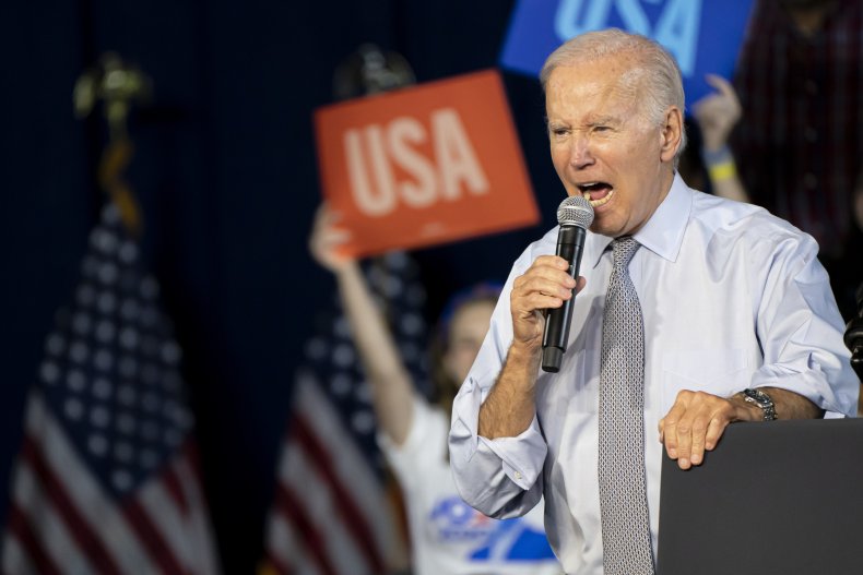 Joe Biden speaks into a mic