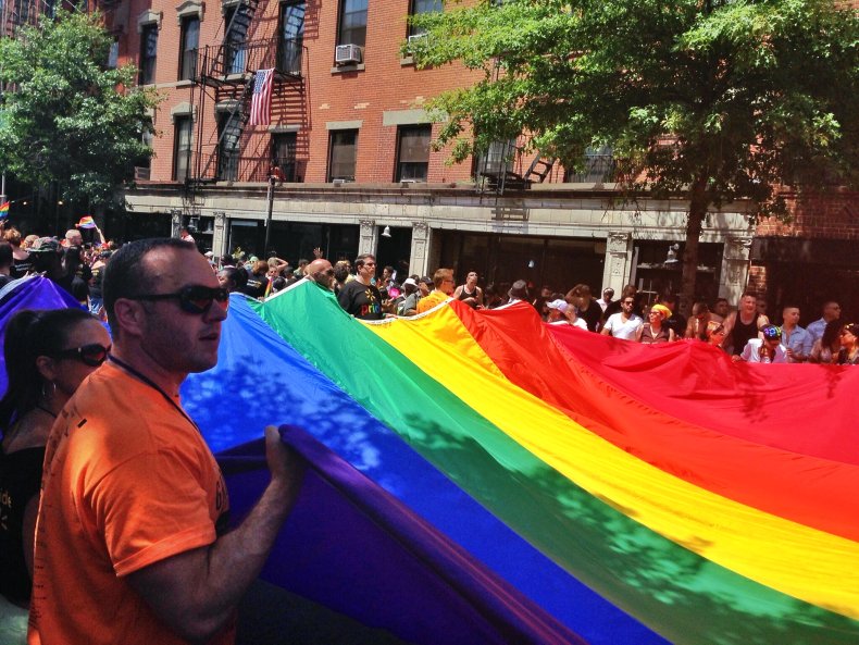 People Carry A Pride Flag