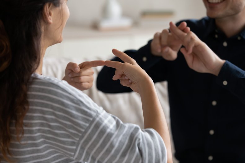 Couple using sign language.