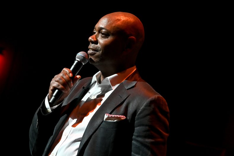 Dave Chappelle performing on stage 