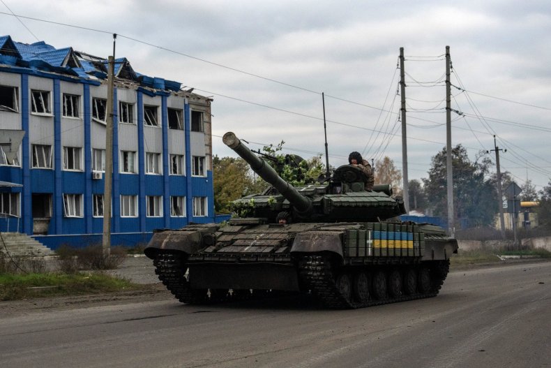 Ukrainian soldier rides in a tank