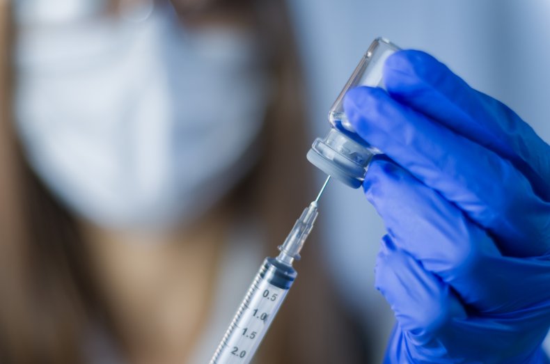 Doctor holding COVID vaccine
