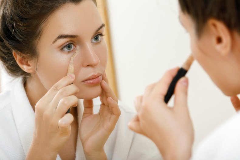 Woman applying make-up
