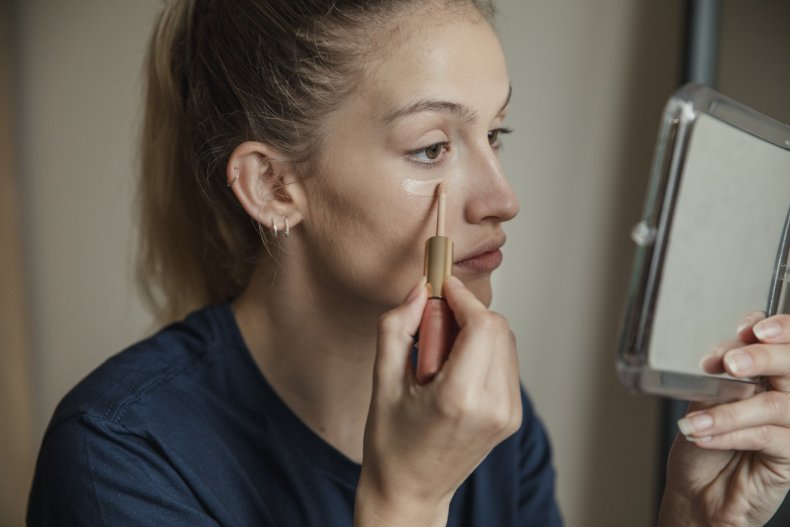 Woman applying make-up