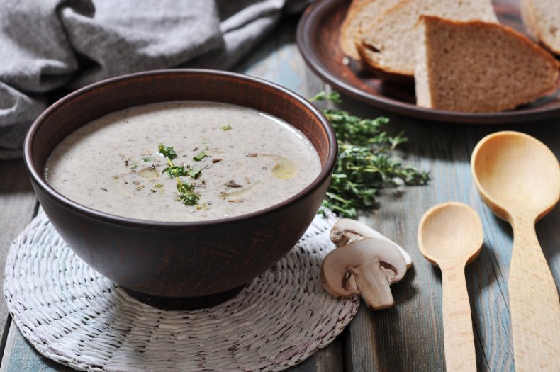 Bowl of mushroom soup on table.